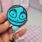 PATCHWORK RAG DOLL FACE BADGE REEL